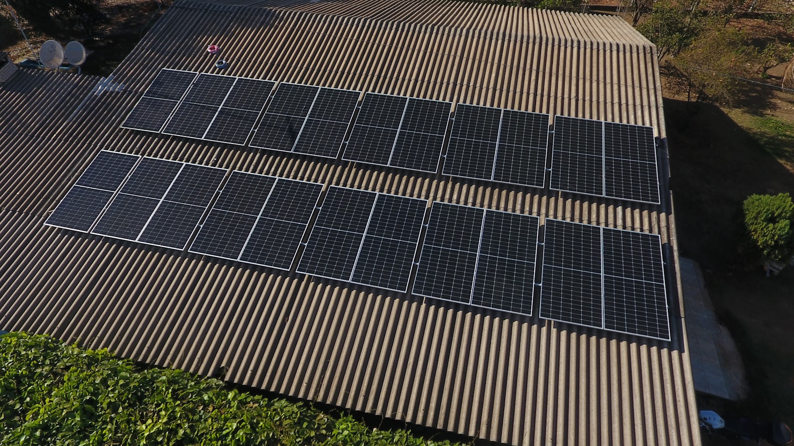 Aerial view of a full solar panel array on a rooftop