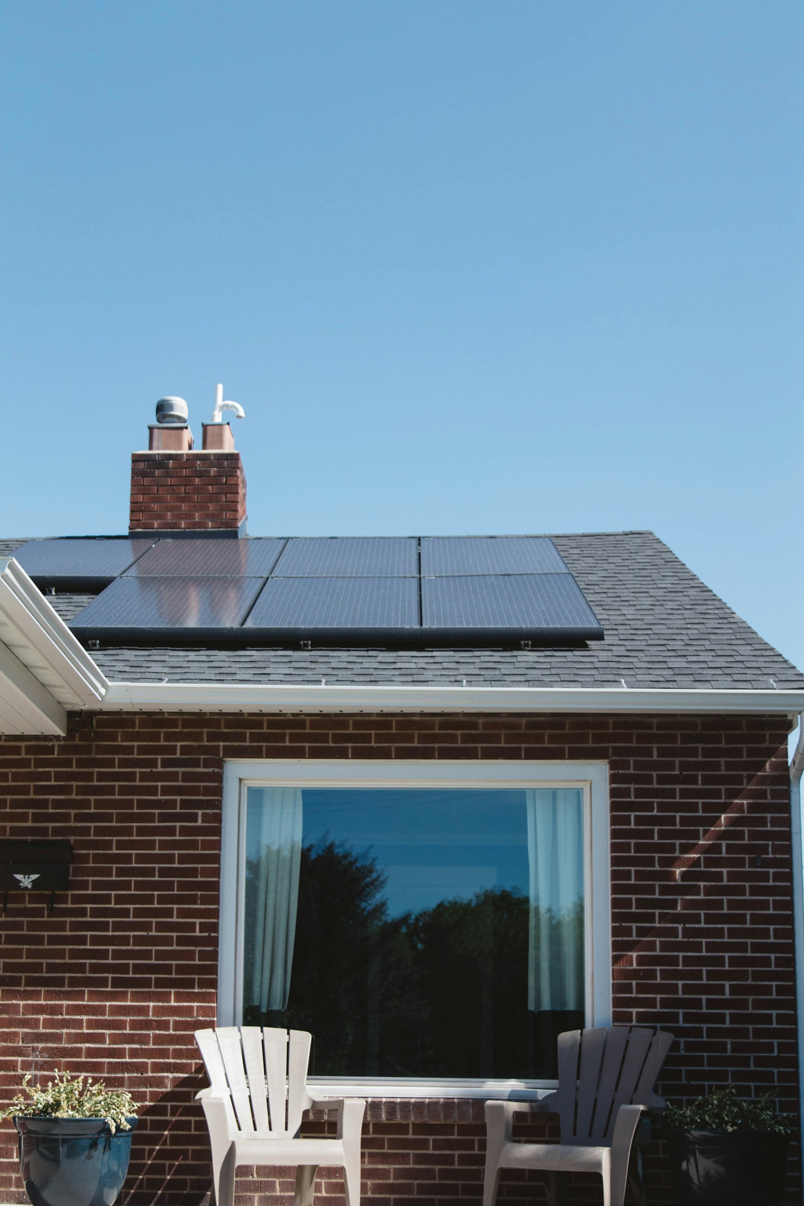 Brick house with solar panels installed on the roof